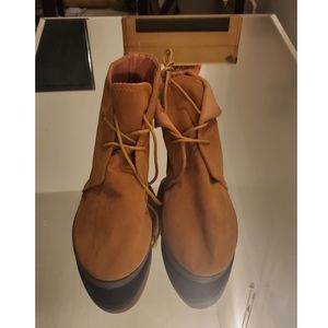 Tan material boots.